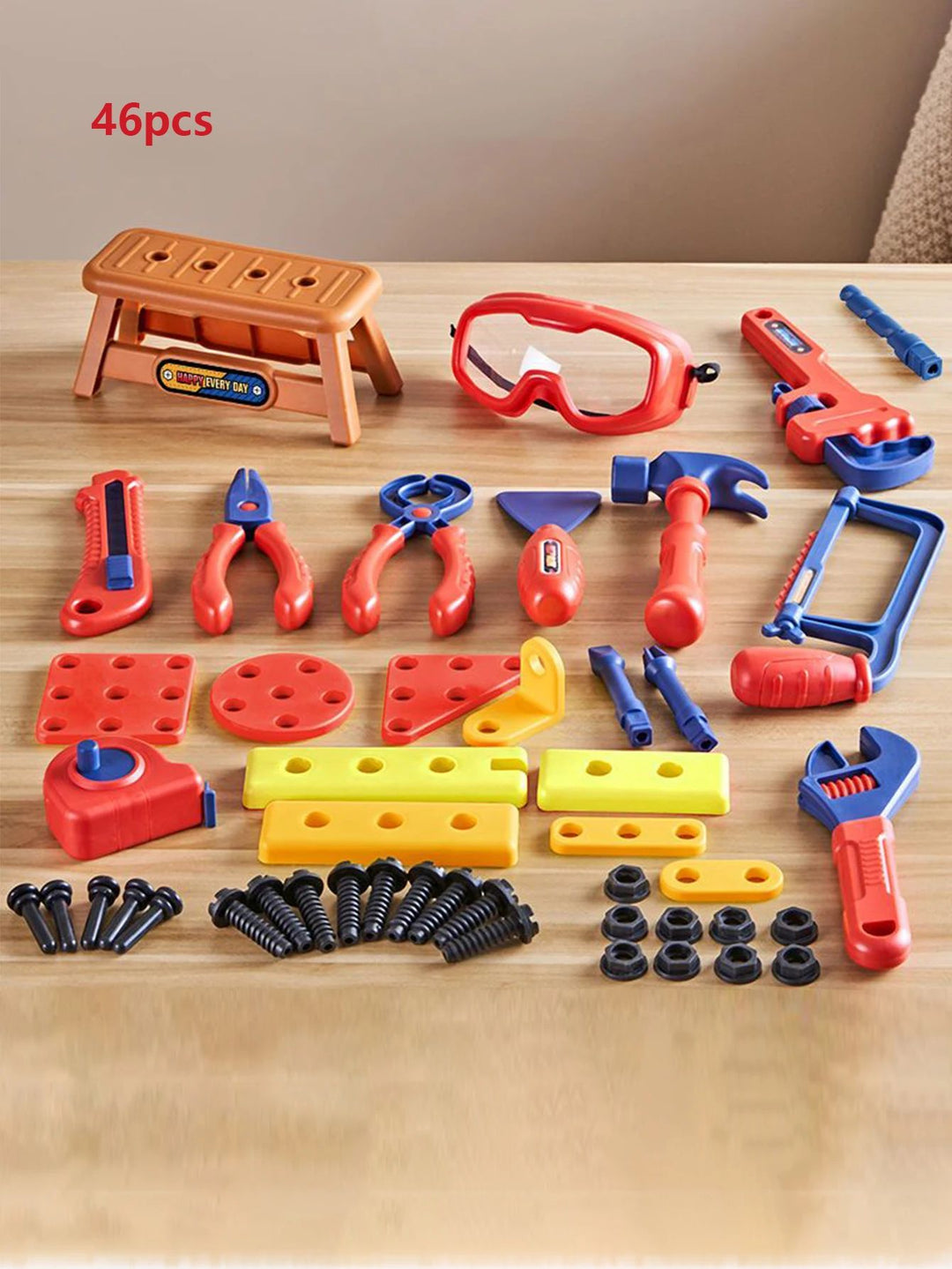 46-piece toy tool set with hand tools, goggles, a mini workbench, screws, and building pieces