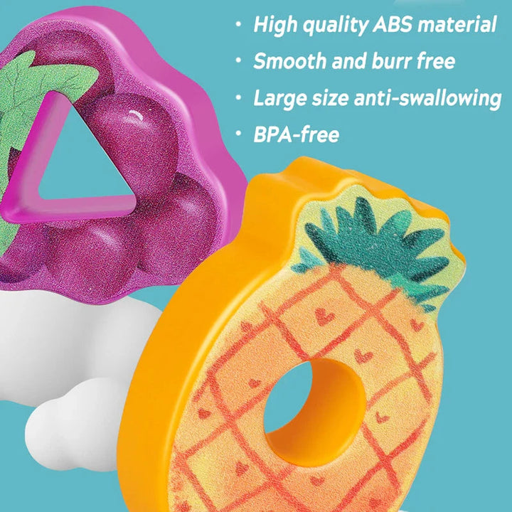 Close-up of ABS pineapple and purple fruit pieces with round and triangular openings