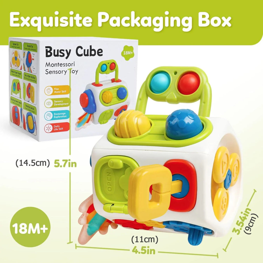 Activity cube beside its box with dimensions of 14.5 by 9 by 11 cm and an 18-month-plus age label