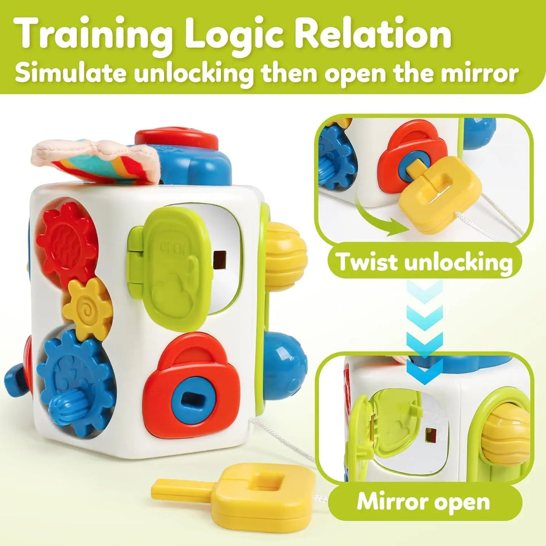 Activity cube with turning gears and a key-operated door that opens to reveal a mirror