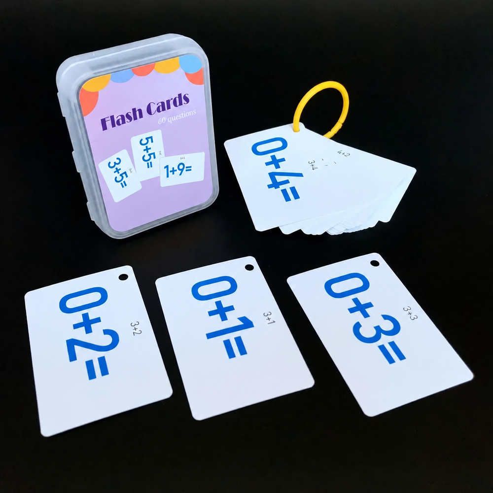 Addition flash cards with blue equations displayed beside their case and yellow ring.