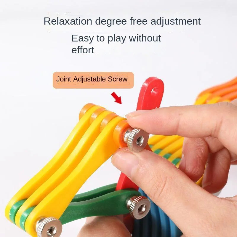 Fingers adjusting a silver joint screw on the colorful wooden folding puzzle
