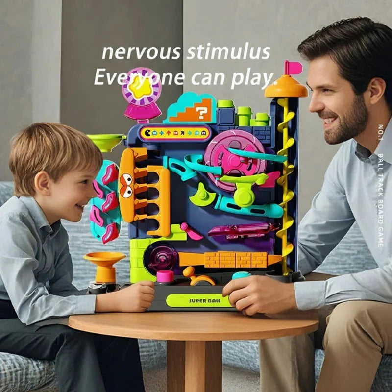 An adult and child playing together with the upright ball track on a small table