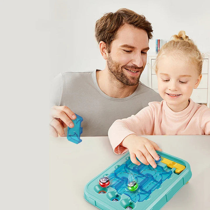 An adult and child arranging blue path tiles on the maze puzzle board