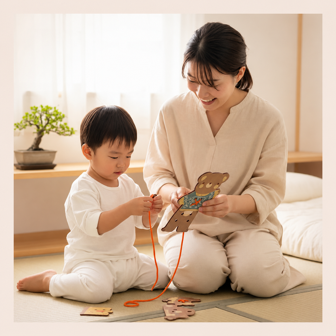 An adult helps a child thread an orange cord through the wooden bear board.