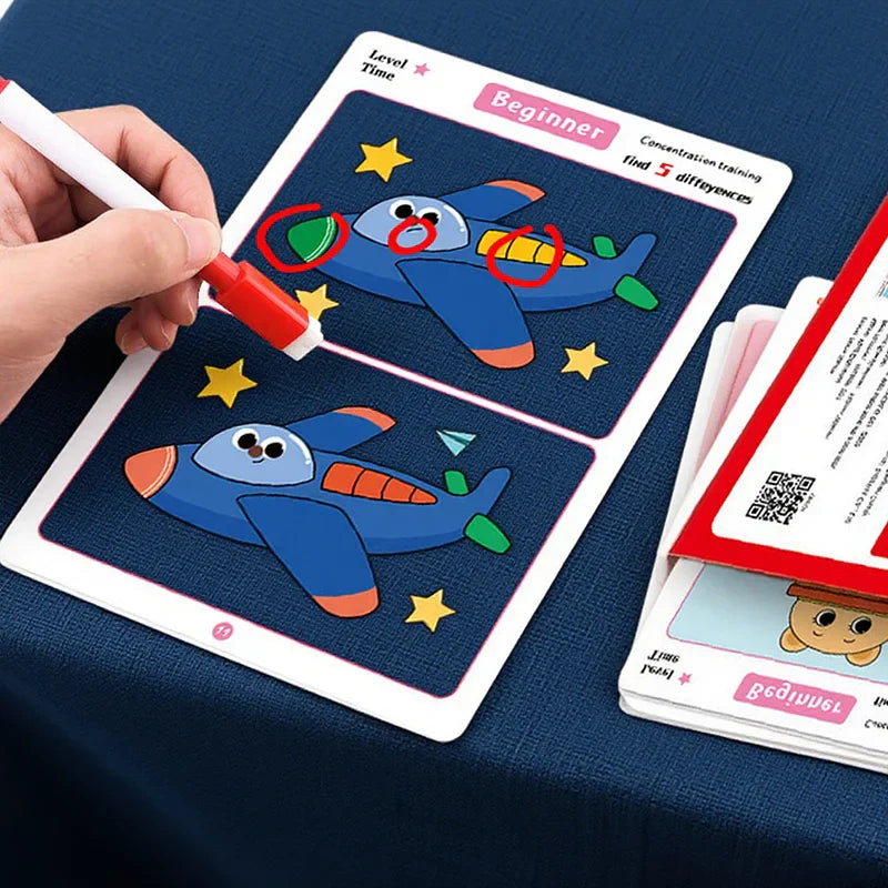 Hand marking differences on an airplane activity card with a wipe-clean marker