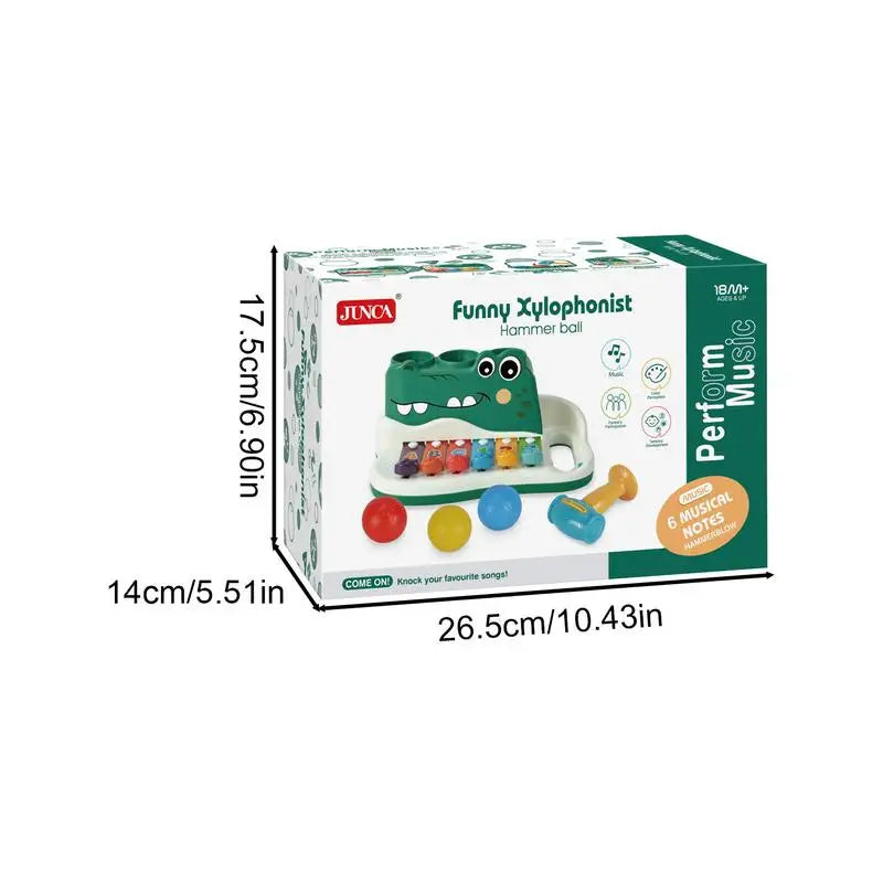 Alligator musical toy packaging with labeled box dimensions of 26.5 × 14 × 17.5 cm