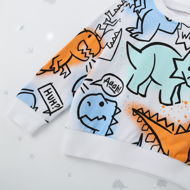 Sleeve and hem details on a white sweatshirt with colorful outline dinosaur prints