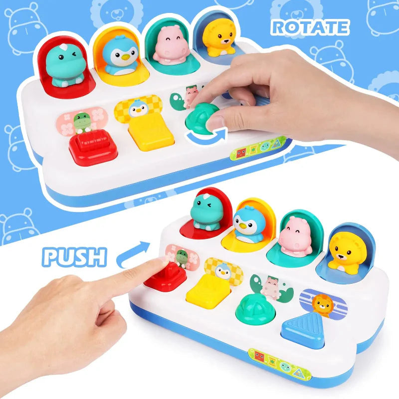 Hands turning the green dial and pushing the red control on an animal activity toy