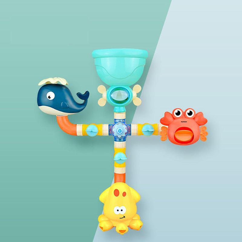 Colorful bath fountain with a turquoise funnel, whale, crab, and yellow lower sprayer on a two-tone background