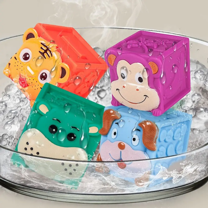 Tiger, monkey, hippopotamus and puppy blocks in a clear bowl of water