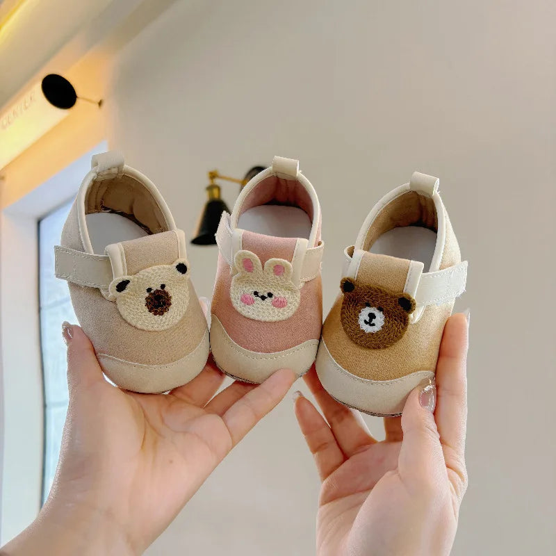 Khaki, pink, and brown baby shoes with bear and bunny details