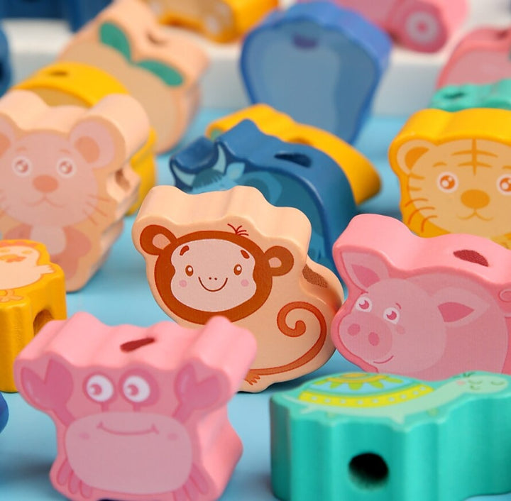 Animal-shaped wooden beads with monkey, pig, lion, and hippo designs