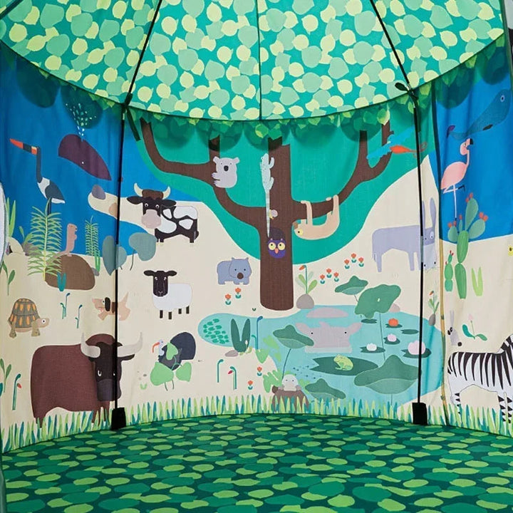 Interior of the play tent with animal-print walls and a green leaf-patterned floor