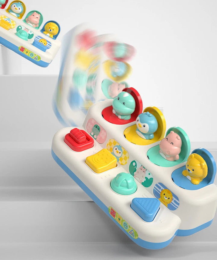 Angled view of the animal pop-up toy with colorful controls and open character lids