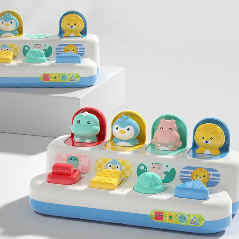 Two animal pop-up activity toys displayed with open character lids