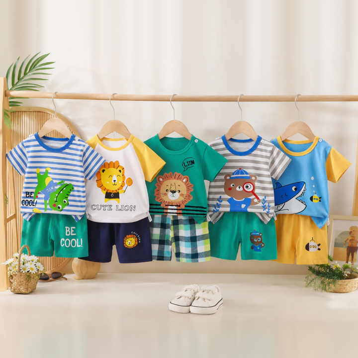 Five animal-print shirt and shorts sets hanging on a wooden clothing rack.