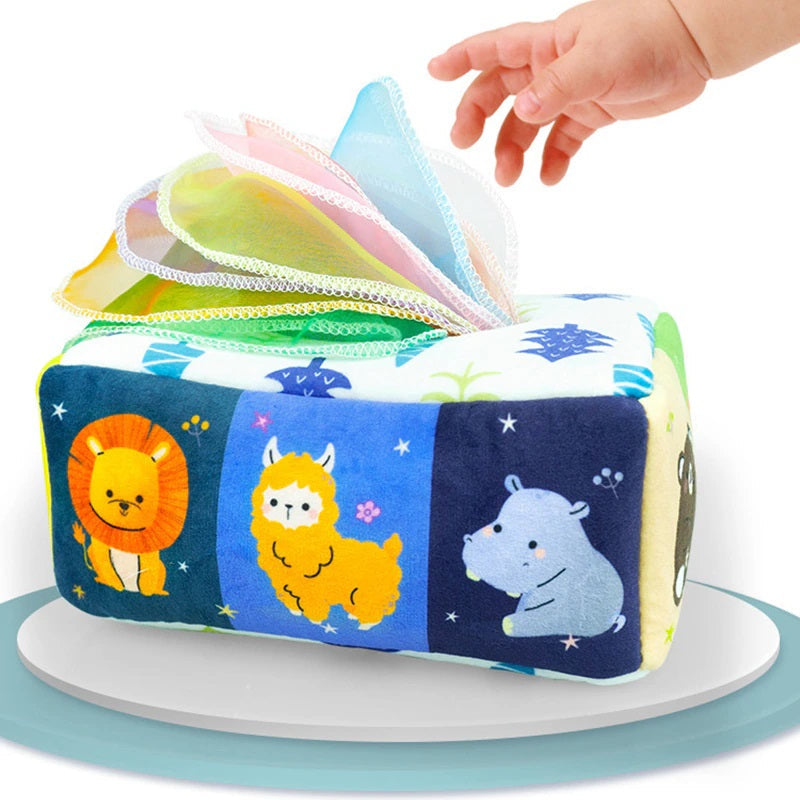 Animal-print fabric tissue box with colorful tissues and a hand reaching toward them