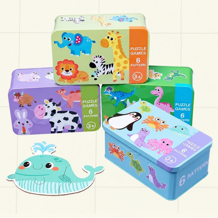 Animal-themed puzzle storage tins with a completed whale puzzle in front