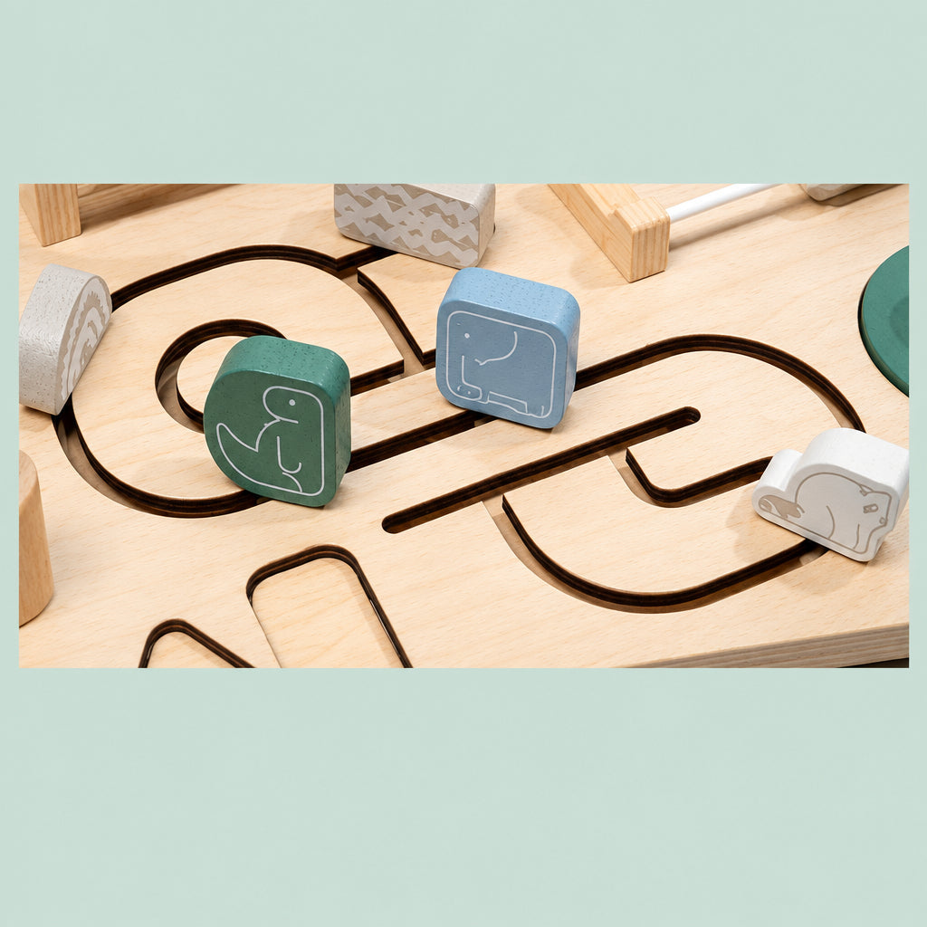 Animal-marked wooden sliders on winding tabletop tracks