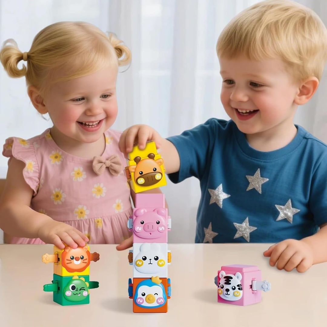 Two children build colorful towers with animal-face stacking blocks.