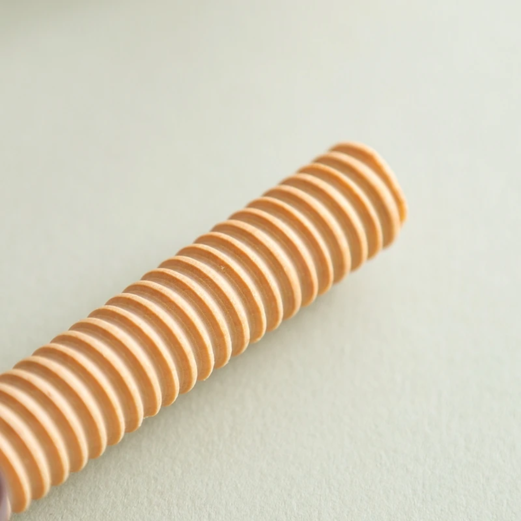 Close-up of the threaded wooden post used inside an animal stacking toy