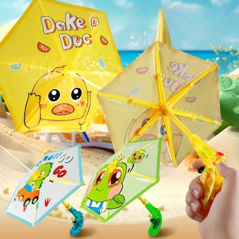 Duck, frog, and dinosaur umbrella water guns with a hand holding an open canopy