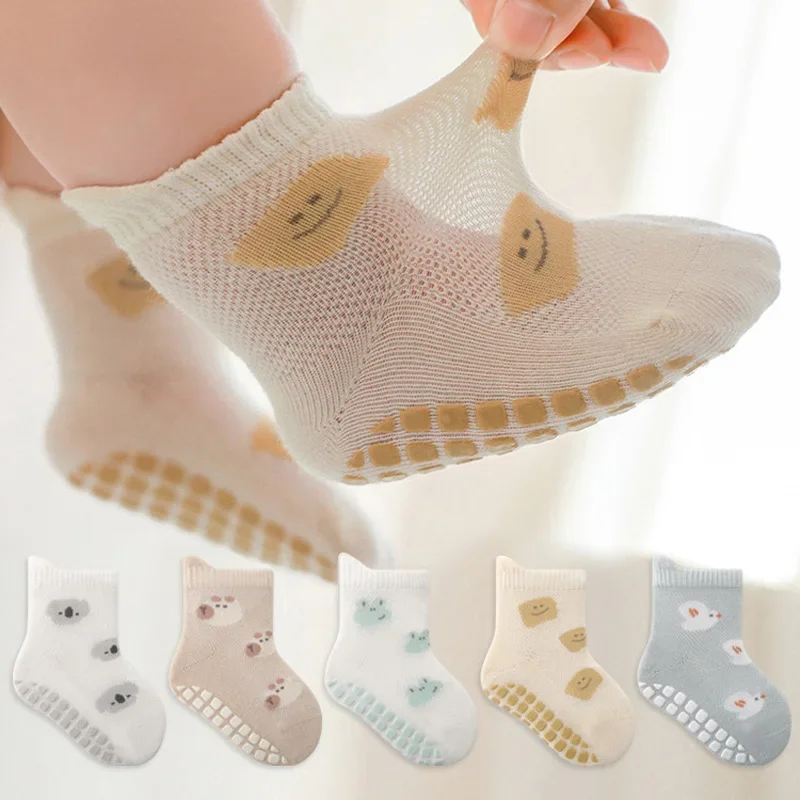 Smiley baby sock with its cuff stretched by hand, plus five patterned sock styles shown below.