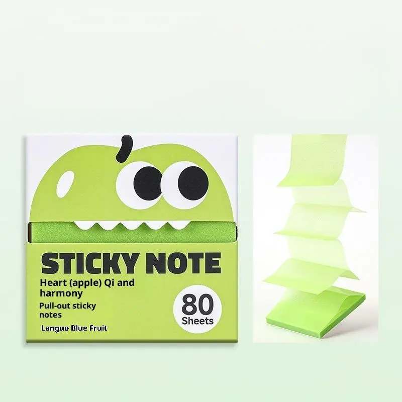 Apple green sticky notes with cartoon apple packaging beside pulled-out sheets