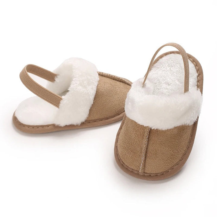 Apricot baby slippers shown from the front and side with white plush trim