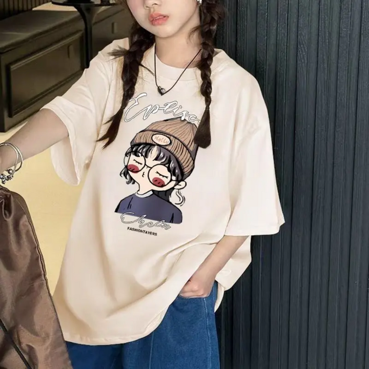 Girl wearing an apricot cartoon-print T-shirt with blue jeans