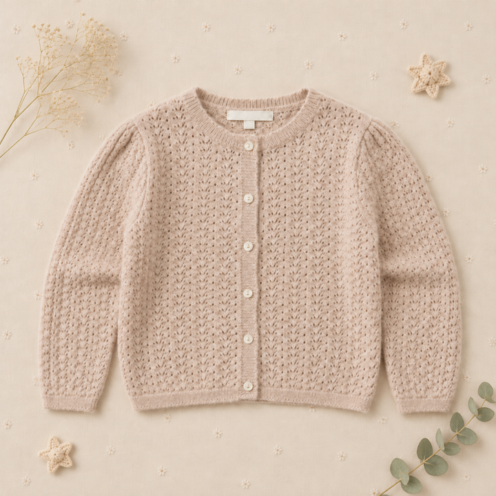 Front of the apricot cotton cardigan with long sleeves and pointelle stitching