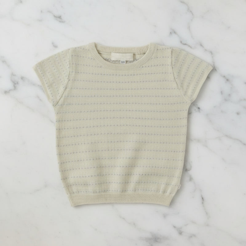 Apricot short-sleeve knit top with a round neck, openwork pattern, and ribbed hem