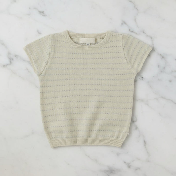 Apricot short-sleeve knit top with a round neck, openwork pattern, and ribbed hem