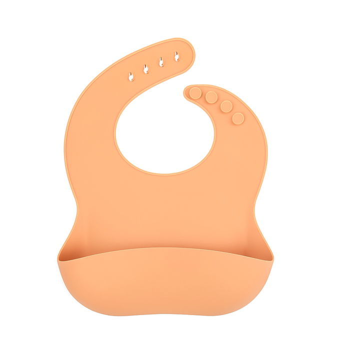 Apricot silicone bib with a wide front pocket and adjustable snap neck.