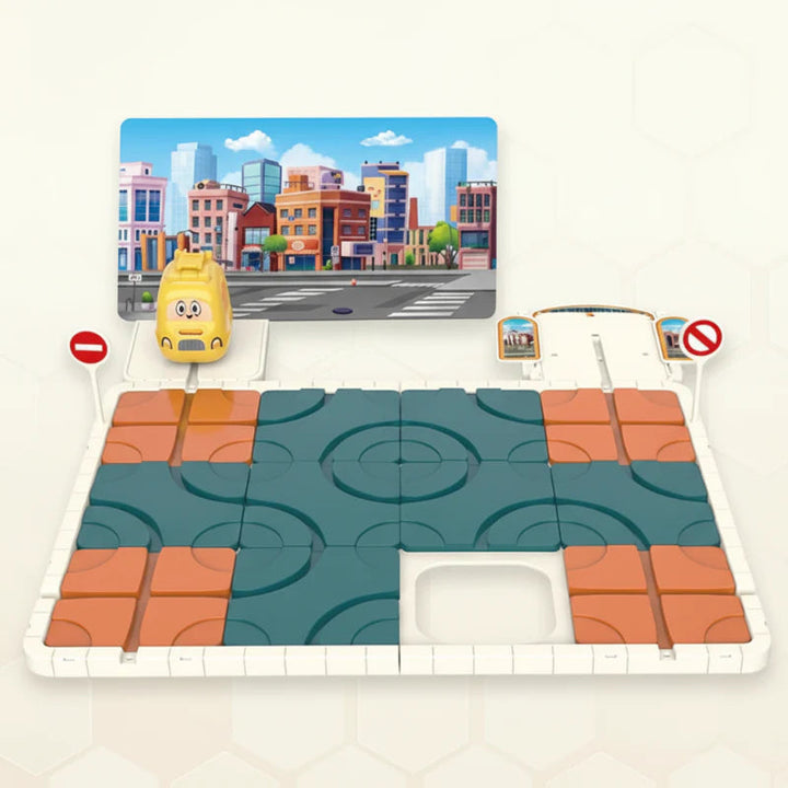 Assembled route puzzle with blue and orange track tiles, a yellow car, and two road signs