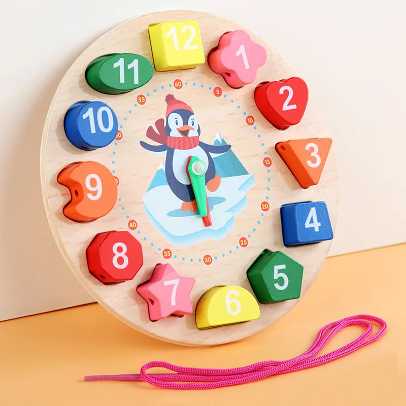 Wooden clock with shaped number blocks from 1 to 12 and a pink threading lace beside it