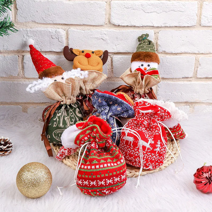 Assorted Christmas character gift bags in red, green, and blue, displayed with holiday ornaments.