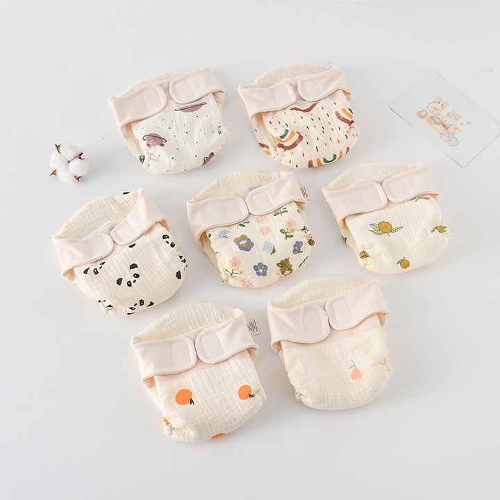 Assorted printed cloth diapers arranged with their hook-and-loop waistbands facing forward