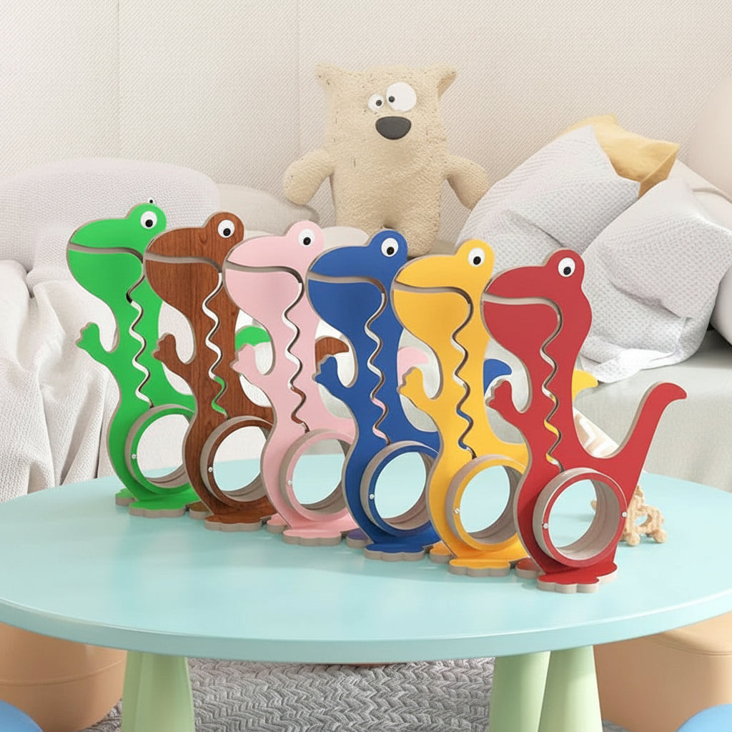 Six dinosaur piggy banks in assorted colors lined up on a round table