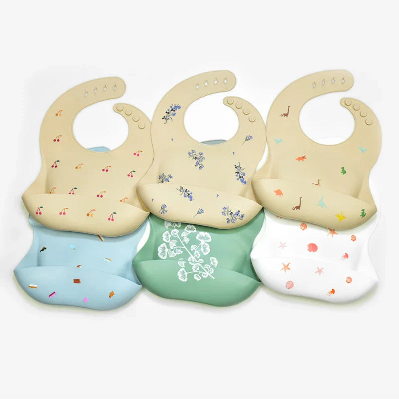 Assorted silicone bib designs with front pockets and adjustable neck closures