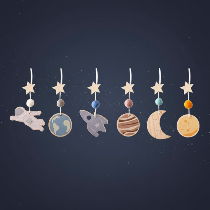 Astronaut hanging toy set with space figures, stars, planets, and a crescent moon.
