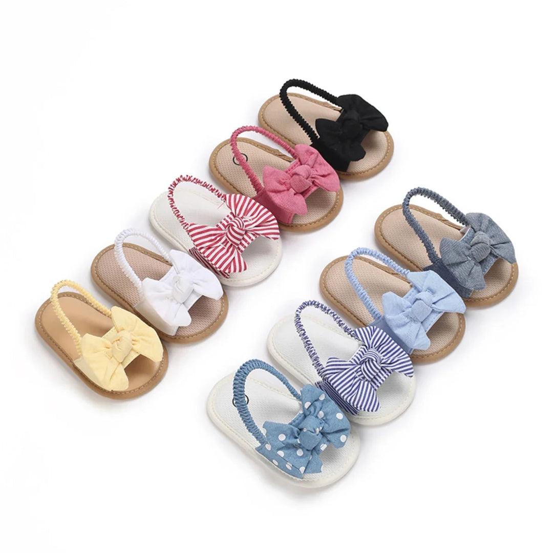 Baby bow sandals in assorted solid colors, stripes, and polka dots