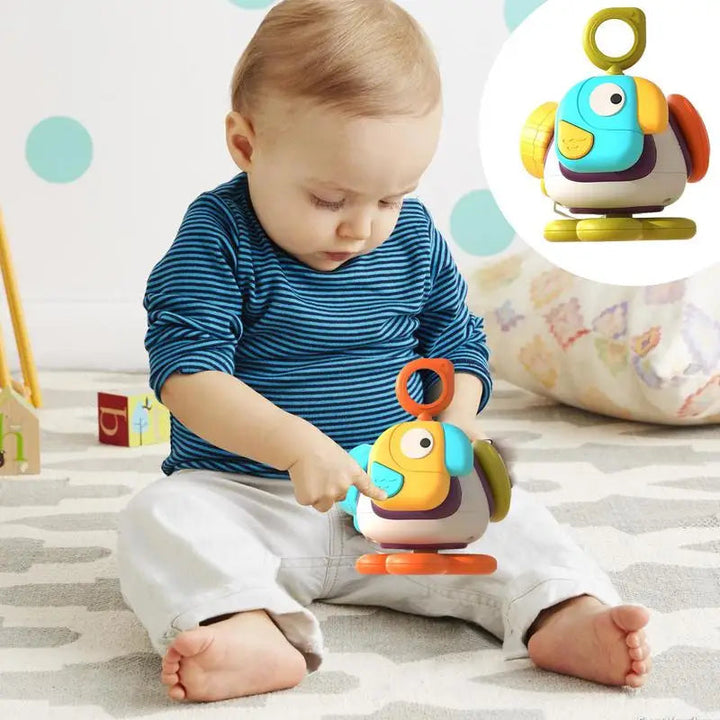 Baby exploring the front of a colorful bird activity toy with an orange ring