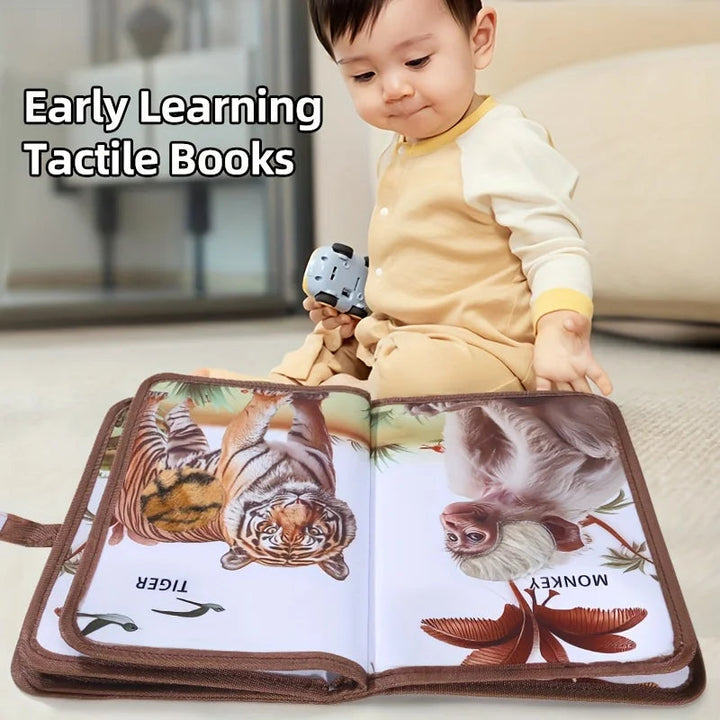 Baby exploring an open animal sensory book with tiger and monkey illustrations.
