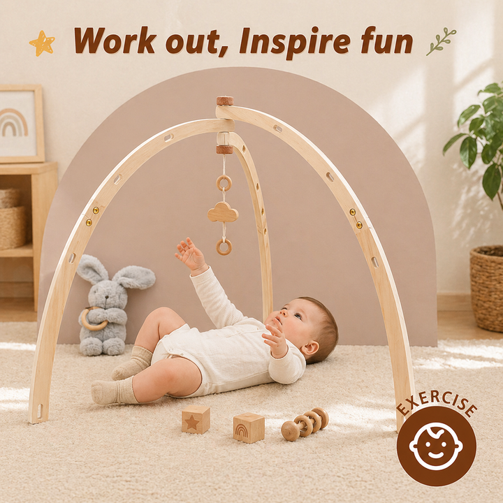 Baby reaching for a hanging wooden ring beneath a curved wooden baby gym.