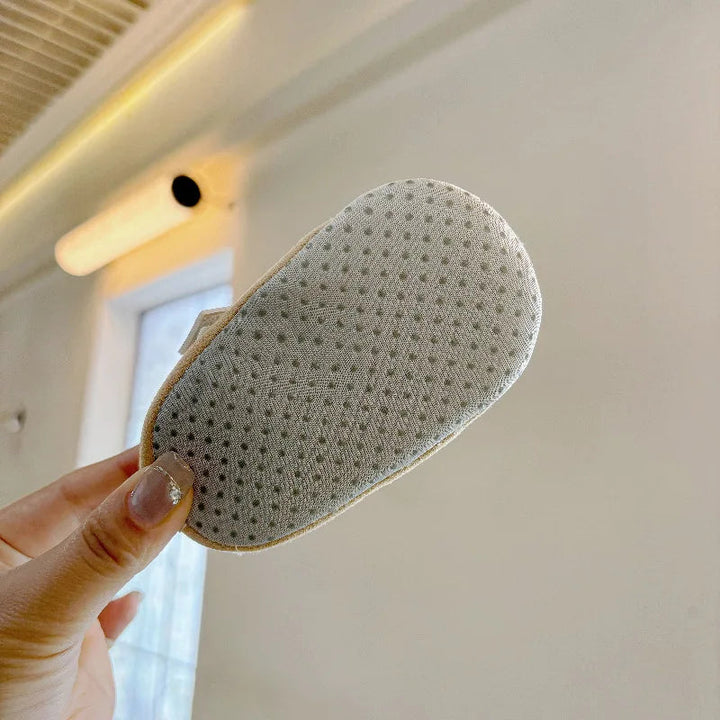 Close-up of the dotted texture on a baby shoe sole