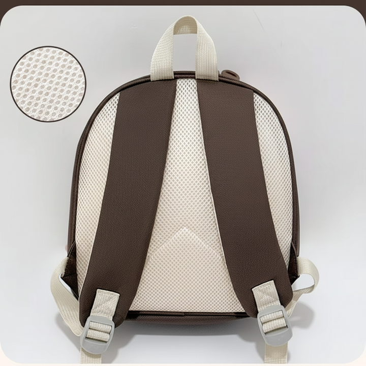 Rear view of the backpack with a mesh back panel and adjustable brown shoulder straps