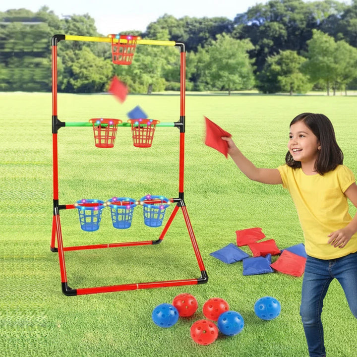 Girl playing a six-basket beanbag toss game on grass, with red and blue balls beside the frame.