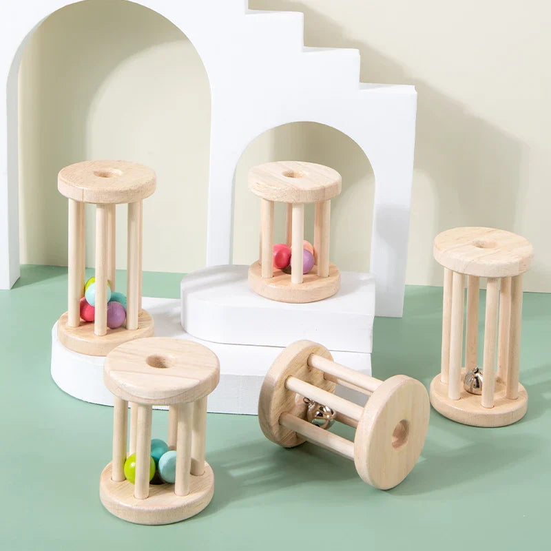 Short and long wooden rattles arranged on white platforms against a green background